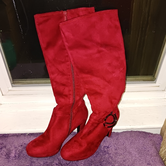 A brand new pair of impo burgundy knee high boots size 8